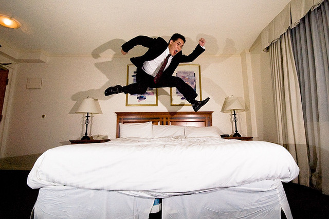 Hotel room man jump