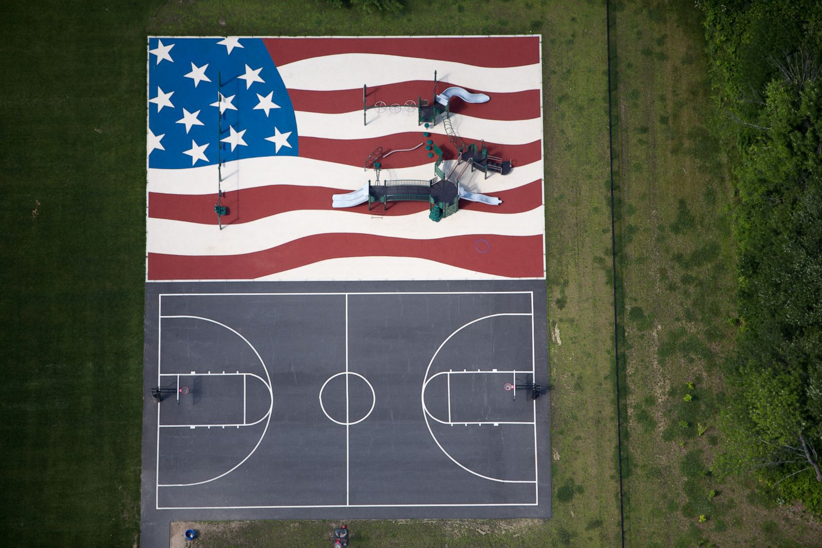 An American flag playground and a basketball court in Stow, Massachussetts