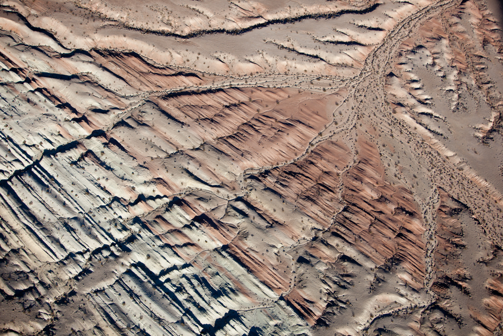 Drainage pattern across striated tilted interbeded rock