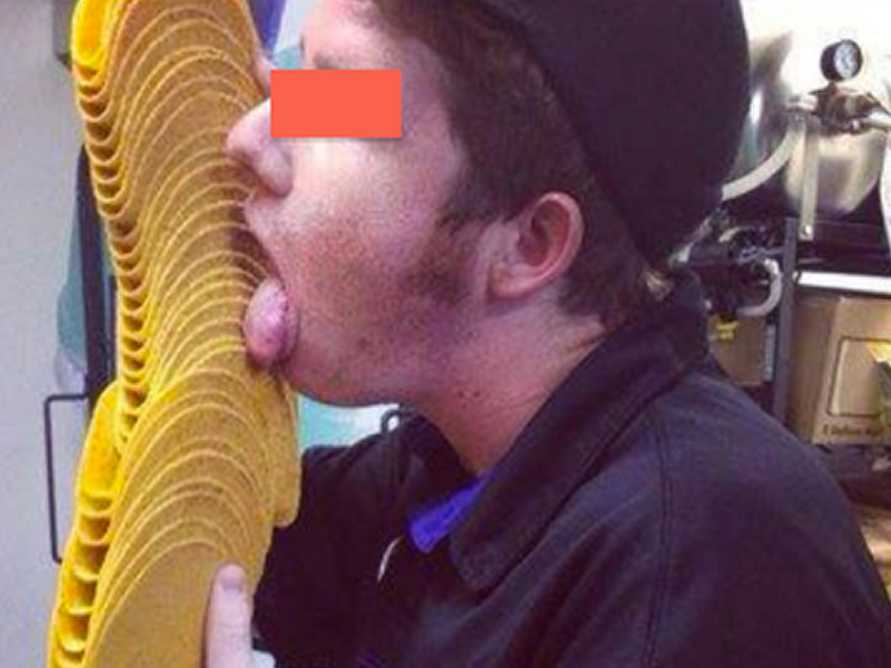 Taco Bell employee licking food