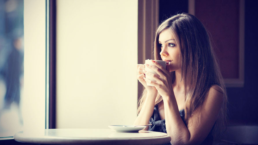 Woman At A Cafe